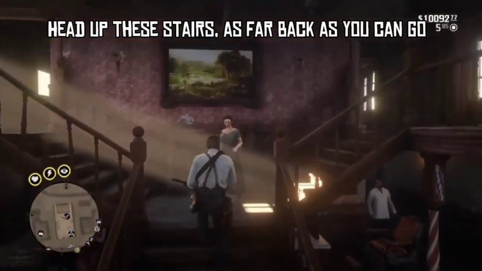 Go up the stairs, as far back as you can